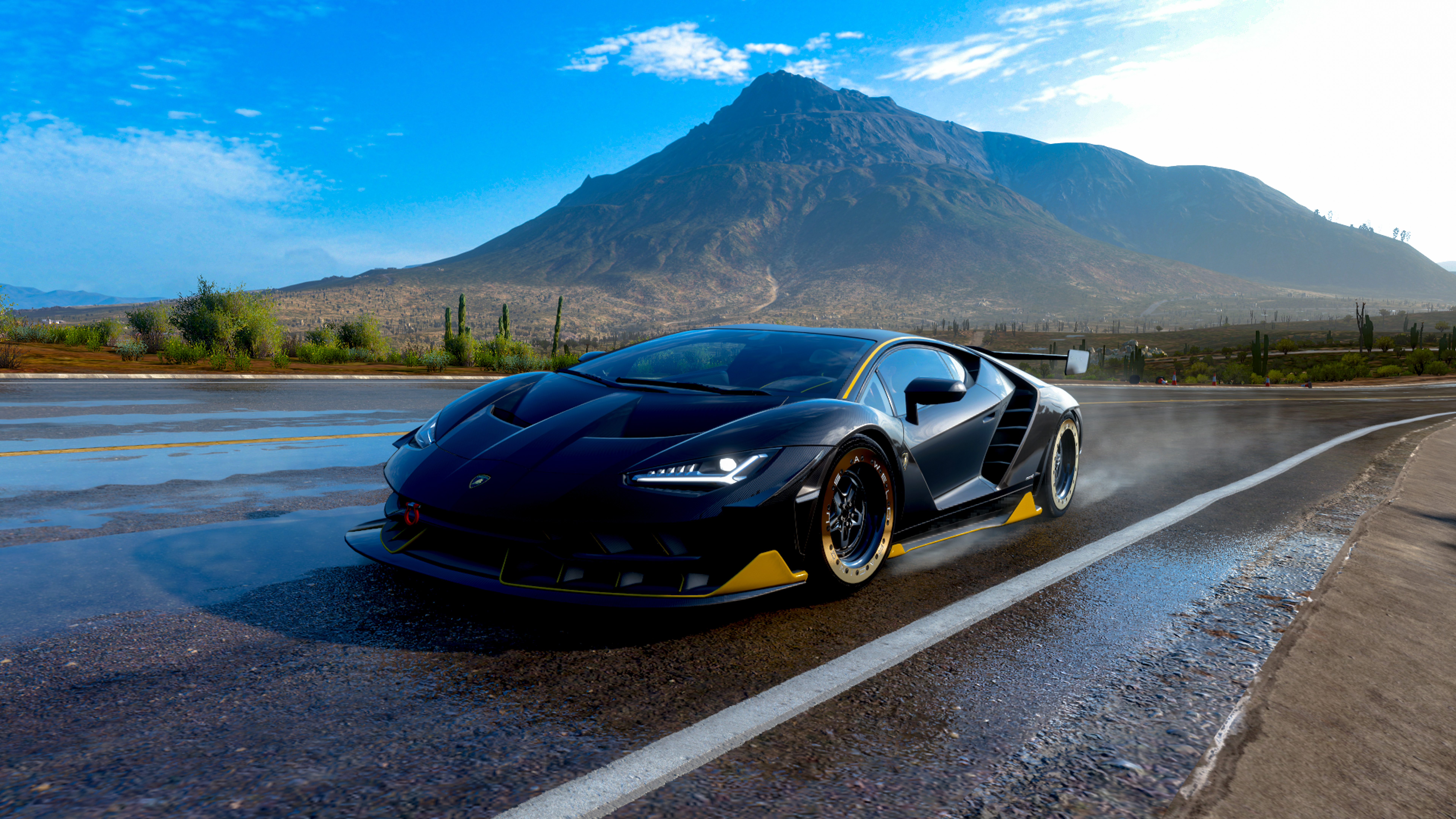 Centenario Unleashed: Black Lamborghini on a Slick Mountain Pass