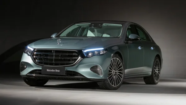 Sleek Teal Mercedes-Benz Sedan with Illuminated Features