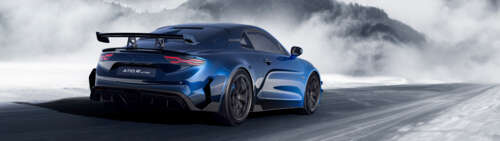A detailed view of the Alpine A110 R Ultime sports car, showcasing its aerodynamic... Dual UHD wallpaper for laptop download