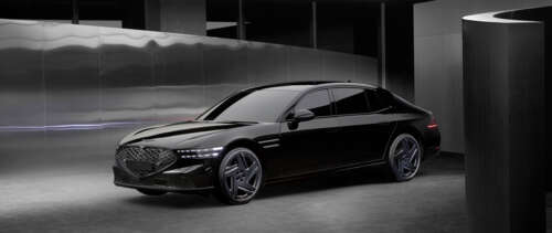 A high-end Genesis G90 luxury sedan displayed in a professional setting. UWUHD hd background