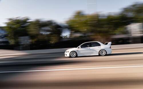 A detailed view of a Mitsubishi Lancer Evolution IX sports sedan. 7680x4800 background images hd
