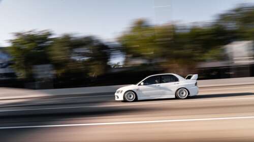 A detailed view of a Mitsubishi Lancer Evolution IX sports sedan. 8K pictures for wallpaper