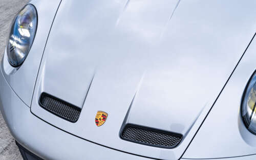 A high-performance Porsche GT3 RS sports car showcasing its sleek aerodynamic design. 7680x4800 wallpaper photo gallery download