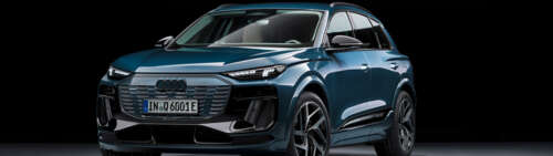 A high-detail view of a modern Audi Q6 E-tron electric luxury SUV. Dual UHD free background images