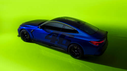A sleek BMW M4 CS Edition featuring the yellow and black VR46 Valentino Rossi racing... 8K free hd wallpapers