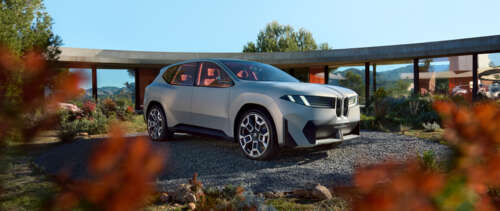 A futuristic BMW Vision Neue Klasse X electric concept car with a modern, aerodynamic... UWUHD wallpaper for pc download