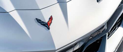 A sleek and aerodynamic Chevrolet Corvette C8 sports car showcasing its mid-engine... UWUHD ps4 wallpaper