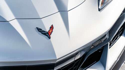 A sleek and aerodynamic Chevrolet Corvette C8 sports car showcasing its mid-engine... 8K ps4 wallpaper