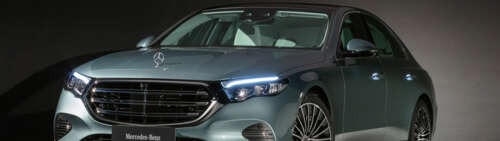 A high-resolution view of a luxury Mercedes-Benz E-Class sedan. Dual UHD wallpaper images