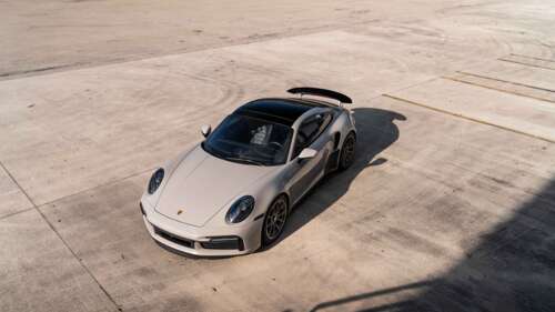 A sleek and modern Porsche sports car showcasing its aerodynamic design and polished... 8K free wallpaper for computer