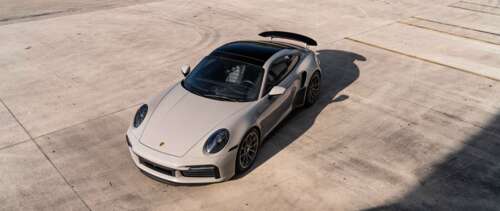 A sleek and modern Porsche sports car showcasing its aerodynamic design and polished... UWUHD computer backgrounds
