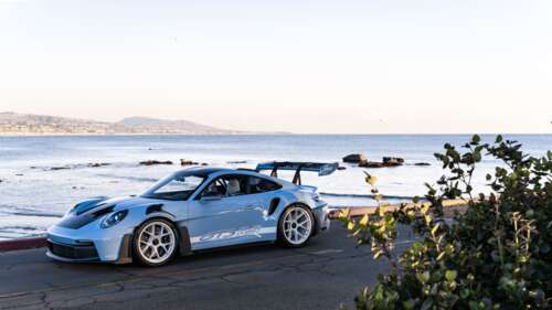 A high-performance Porsche sports car with a sleek, aerodynamic design. 4K (Ultra HD) free background images