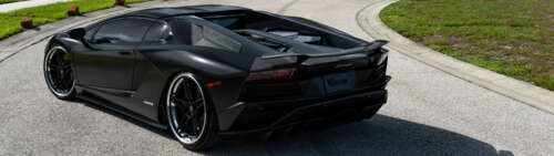 A sleek, high-end Lamborghini supercar captured in high detail. Dual UHD hd background