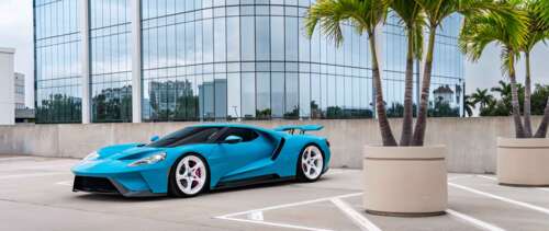A sleek and powerful Ford GT supercar featuring its signature aerodynamic body and... UWUHD free background