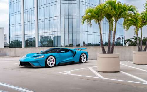 A sleek and powerful Ford GT supercar featuring its signature aerodynamic body and... 7680x4800 wallpaper for laptop download