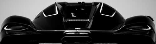 A detailed view of the aerodynamic Koenigsegg Jesko Absolut hypercar. Dual UHD wallpaper for laptop download