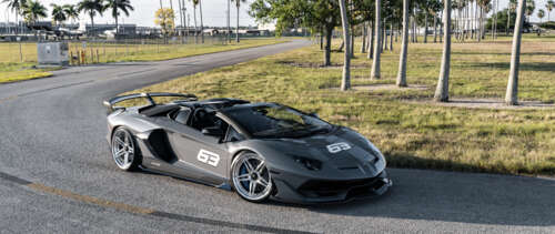 A sleek and powerful Lamborghini Huracan supercar showcasing its aerodynamic design... UWUHD free wallpaper for computer