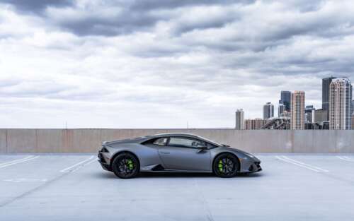 A sleek and powerful Lamborghini Huracán supercar displayed in a professional setting. 7680x4800 pictures for wallpaper