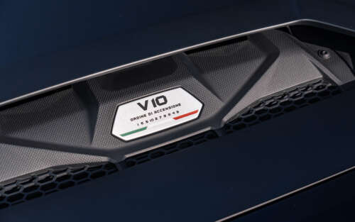 A sleek Lamborghini Huracán supercar captured in high detail, showcasing its aerodynamic... 7680x4800 ps4 wallpaper