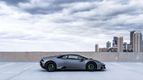 A sleek and powerful Lamborghini Huracán supercar displayed in a professional setting. 4K (Ultra HD) free wallpaper for computer