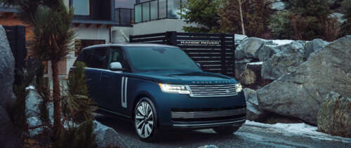 A sleek and luxurious Range Rover SV automobile featuring a premium metallic finish... UWUHD desktop wallpaper
