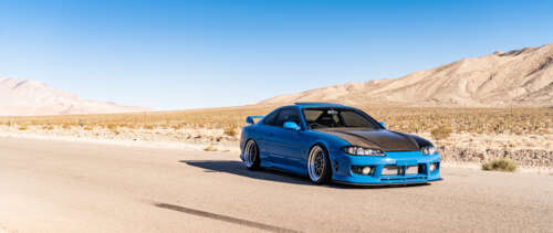 A high-performance Nissan Silvia S15 sports car showcased in a dramatic setting. UWUHD wallpaper images