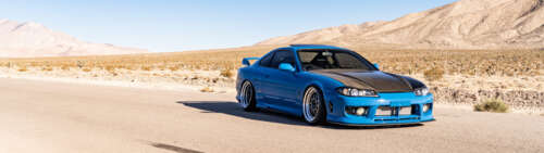 A high-performance Nissan Silvia S15 sports car showcased in a dramatic setting. Dual UHD wallpaper