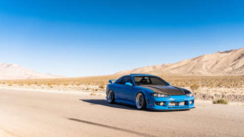 A high-performance Nissan Silvia S15 sports car showcased in a dramatic setting. 4K (Ultra HD) hd background