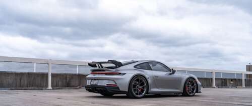 A high-performance Porsche GT3 RS sports car featuring aerodynamic styling and a... UWUHD free wallpaper for computer