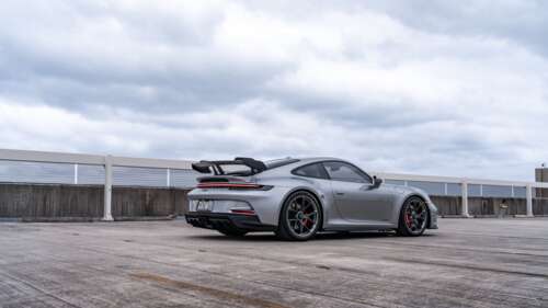 A high-performance Porsche GT3 RS sports car featuring aerodynamic styling and a... 4K (Ultra HD) free wallpaper for computer