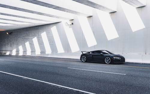 A close-up view of a sleek, modern Audi luxury car showcasing its elegant lines and... 7680x4800 free desktop wallpaper