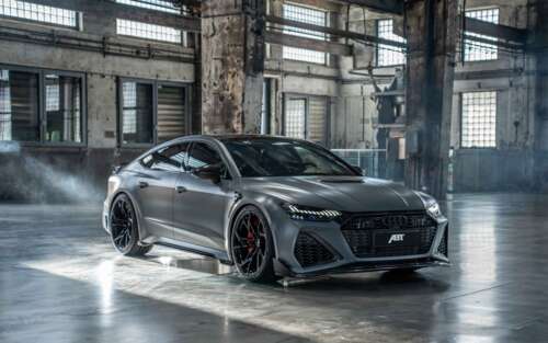 A high-performance Audi RS7 sedan with a sleek, metallic body and aggressive front... 7680x4800 high definition wallpaper