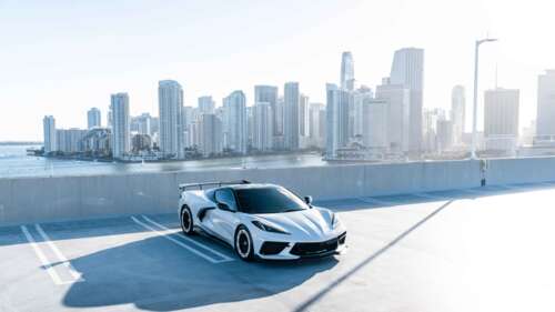 A high-performance Chevrolet Corvette C8 sports car featuring a modern aerodynamic... 4K (Ultra HD) high definition wallpaper