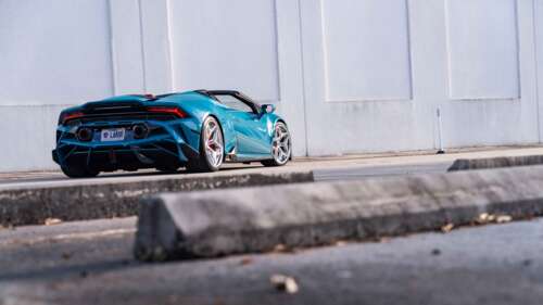 A detailed view of a Lamborghini Huracan Evo featuring its iconic aerodynamic body... 8K free background images