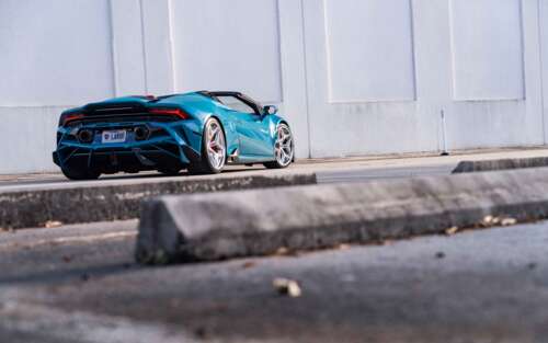 A detailed view of a Lamborghini Huracan Evo featuring its iconic aerodynamic body... 7680x4800 free background
