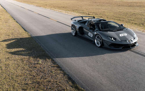 A high-resolution view of a Lamborghini Huracan supercar showcasing its aerodynamic... 7680x4800 free background images