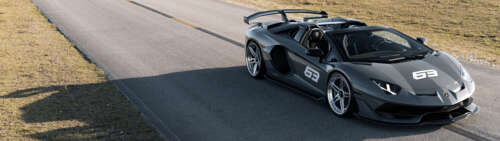 A high-resolution view of a Lamborghini Huracan supercar showcasing its aerodynamic... Dual UHD free background