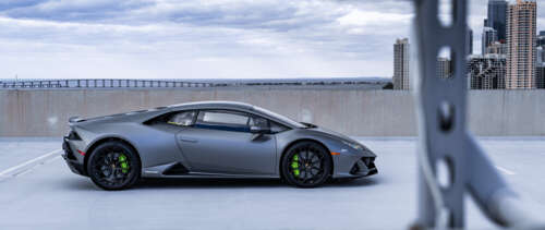 A close-up view of a powerful Lamborghini Huracan sports car highlighting its aerodynamic... UWUHD ps4 wallpaper