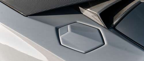 A high-performance Lamborghini Huracán sports car featuring sleek aerodynamic lines... UWUHD free desktop wallpaper