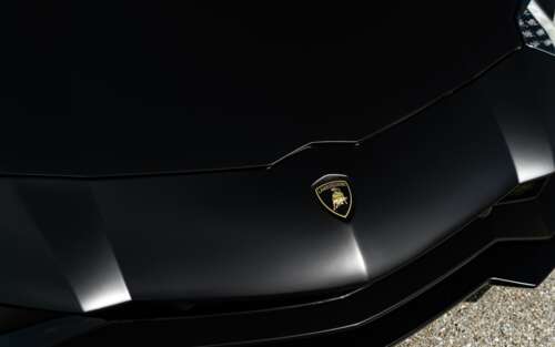 A sleek and aerodynamic Lamborghini supercar featuring a polished-metallic exterior... 7680x4800 free wallpaper for computer