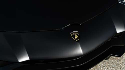 A sleek and aerodynamic Lamborghini supercar featuring a polished-metallic exterior... 4K (Ultra HD) free background