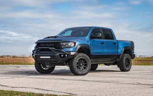 A massive, lifted Hennessey Mammoth 1000 Dodge Ram truck with aggressive off-road... 7680x4800 background images hd