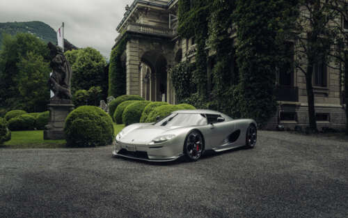 A detailed and sleek view of the Koenigsegg CC850 hypercar highlighting its aerodynamic... 7680x4800 desktop wallpaper