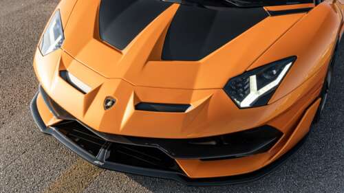 A sleek and powerful Lamborghini Aventador SVJ supercar featuring aggressive aerodynamic... 4K (Ultra HD) free hd wallpapers