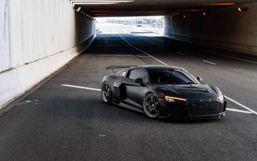 A close-up view of a sleek and modern Audi luxury car with a polished exterior. 7680x4800 wallpaper for pc download