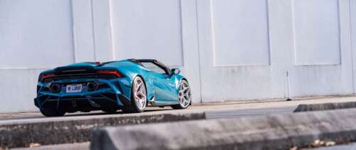 A detailed view of a Lamborghini Huracan Evo featuring its iconic aerodynamic body... UWUHD desktop wallpaper