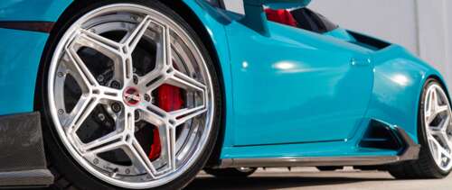 A detailed view of a Lamborghini Huracan Evo showcasing its aerodynamic body and... UWUHD hd background