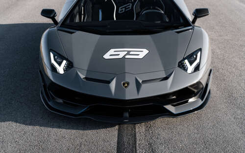 A close-up view of a sleek, high-performance Lamborghini Huracan supercar. 7680x4800 wallpaper