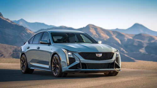 A detailed view of a Cadillac CT5-V Blackwing sedan, emphasizing its modern grille,... 4K (Ultra HD) free background