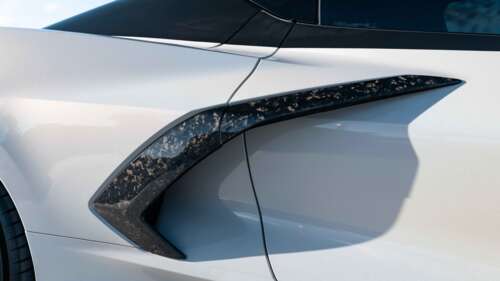 A sleek and powerful Chevrolet Corvette C8 sports car showcasing its aerodynamic... 8K background images hd